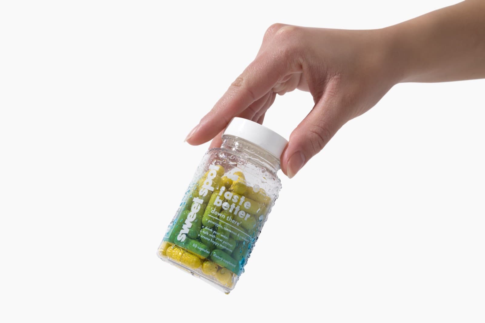 A hand holds the blue-labeled For Him bottle