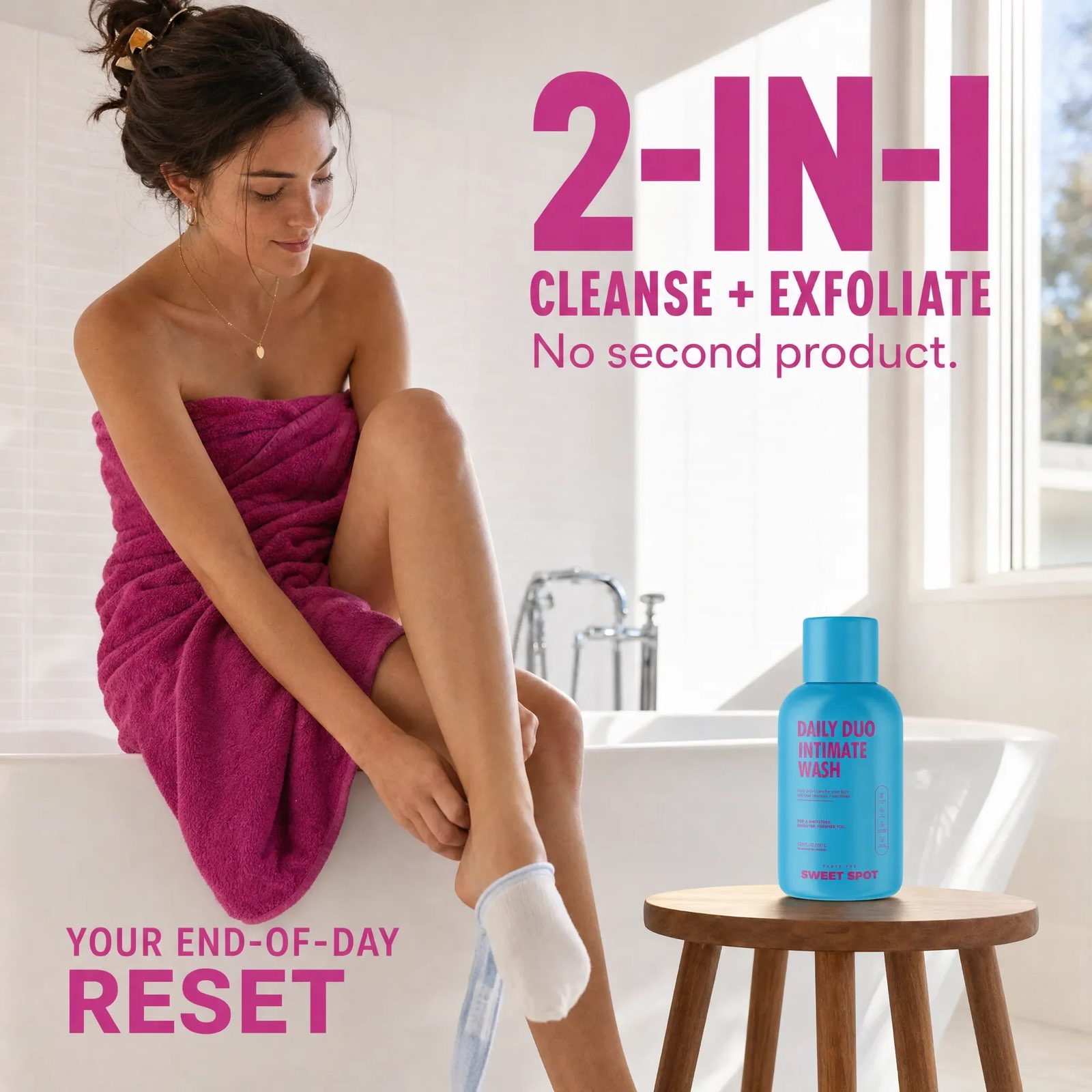 A woman in a magenta towel sits on a bathtub edge beside a blue Daily Duo Intimate Wash on a wooden stool, with large pink 2-in-1 lettering.